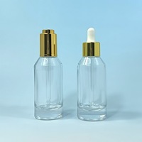 Crème pour le visage verte 50 ml et huile essentielle en flacon en verre avec pulvérisateur à pompe, diffuseur de parfum rond transparent