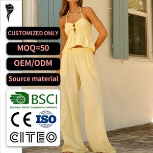 ชุดเซ็ตผ้าลินินสีเหลืองสำหรับผู้หญิง รุ่นใหม่ปี 2026 เสื้อครอปผูกคอแบบฮอลเตอร์และกางเกงขายาวทรงกว้าง สำหรับวันหยุดพักผ่อนริมชายหาดในฤดูร้อน - Product Image 1