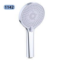 Pomme de douche manuelle en plastique ABS peu coûteuse, facile à nettoyer pour une utilisation à domicile dans la salle de bain.