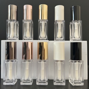 หลอดลิปกลอสทรงเหลี่ยม 8 มล. ยี่ห้อ ISMAN Wholesale สีโรสโกลด์ อำพัน ดำ ขาว ฝาสีดำ ขาว พร้อมหัวแปรงขนาดใหญ่ บรรจุภัณฑ์ลิปกลอสเปล่า - Product Image 1