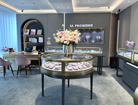 Qualität Full Assem ble Produkt Display Table Gebogenes Display aus gehärtetem Glas Vitrine Zweifarbiges Design Runde Schmuck Vitrine
