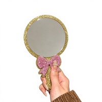 Miroir cosmétique portable à paillettes avec nœud rose et cadre doré, personnalisable avec logo, idéal pour cadeau promotionnel et ornement de bureau
