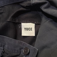 Pantalon cargo multi-poches en patchwork noir pour homme, poches à rabat utilitaires, ourlet zippé, coupe décontractée, pantalon cargo robuste de style streetwear