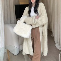 Cardigan en maille torsadée super longue pour femme, style tendance, à manches classiques, ouvert sur la poitrine, avec grandes poches, idéal pour l'hiver et les tenues décontractées