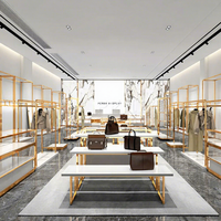 Présentoir à vêtements doré pour la vente au détail, table de présentation emboîtable, étagères à vêtements, présentoir de vêtements, mobilier pour magasin de vêtements