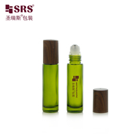 Flacon roll-on en verre vert foncé premium de 10 ml avec couvercle en plastique imprimé imitation bois