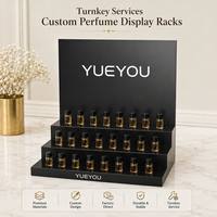 Présentoir de comptoir en acrylique noir brillant à 3 niveaux pour échantillons de parfum, 24 compartiments, avec panneau arrière mat de la marque