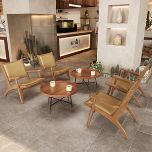 Silla tejida de ratán estilo bohemio y juego de mesa de centro redonda de madera para esquina de salón - Product Image 1