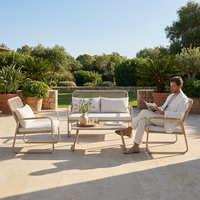 Ensemble de salon de jardin en rotin 4 pièces avec structure en acier thermolaqué et assise en osier tressé pour l'extérieur