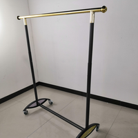 Porte-vêtements pliable télescopique sur pied réglable, support de séchage et de rangement en métal de luxe.
