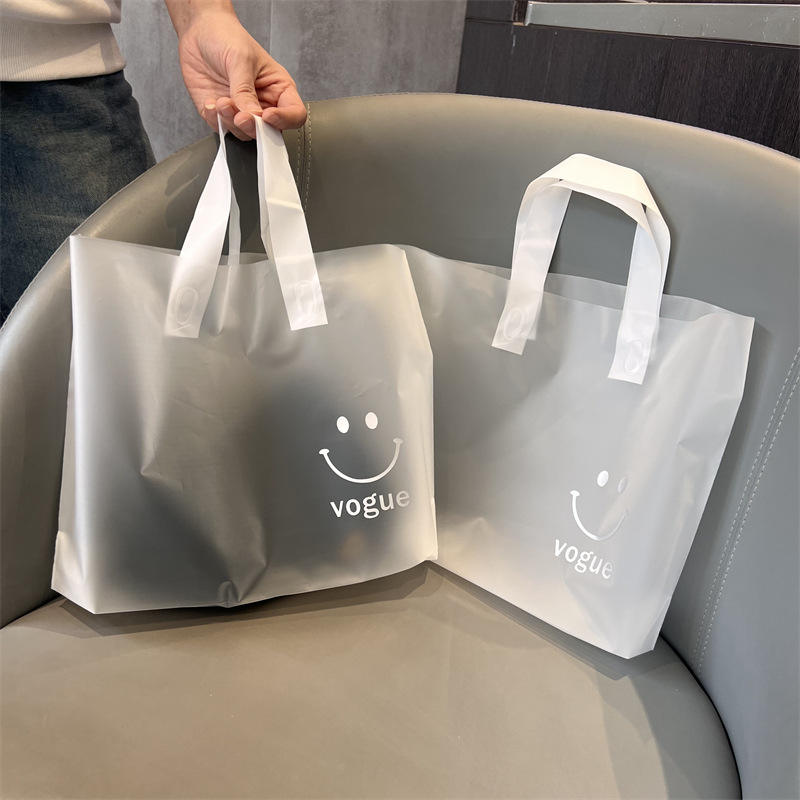 Carry Bag Design For Cloth Shop 8,136 Cloth In Plastic Bag Stock - Main Image