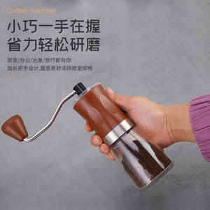 Molinillo de café manual portátil con recipiente de vidrio para uso doméstico, color negro y marrón sólido - Product Image 3