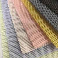 Tissu en maille hexagonale 3D en polyester 100% tricoté doré