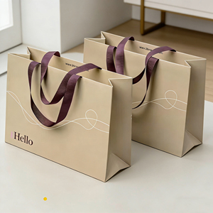 Sacs de transport de luxe sur mesure à <span class=keywords><strong>prix</strong></span> compétitif, sacs cadeaux portables en papier kraft de Chine en gros, petits sacs en papier avec poignée et logo imprimé - Product Image 1