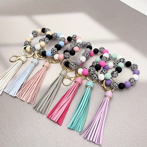 Bracelet créatif en silicone avec des perles rondes en alliage de léopard, impression UV, long pompon doux, cadeau écologique pour hommes et femmes - Product Image 6