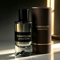 Flacon atomiseur de parfum cylindrique haut de gamme gris fumé à base épaisse, avec fond créatif en forme de montagne de glace et capuchon noir brillant, en verre personnalisé