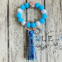 Beliebtes Modisches Vielseitiges Armband Leder-Quastenanhänger Autoschlüsselringe Handgefertigte Bonbonfarbene Silikonperlen Handgelenk-Schlüsselanhänger