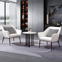 Table basse YZ moderne et durable avec structure en acier noir et plateau en pierre, mobilier de salon pour restaurants et usage domestique