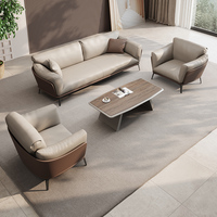 Ensemble canapé et table basse de bureau en cuir, design moderne et épuré, produit phare pour la réception et les négociations professionnelles