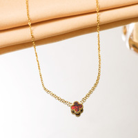 Collier tendance en acier inoxydable hypoallergénique imperméable avec pendentif trèfle à quatre feuilles en zircon, chaîne en corde pour femmes