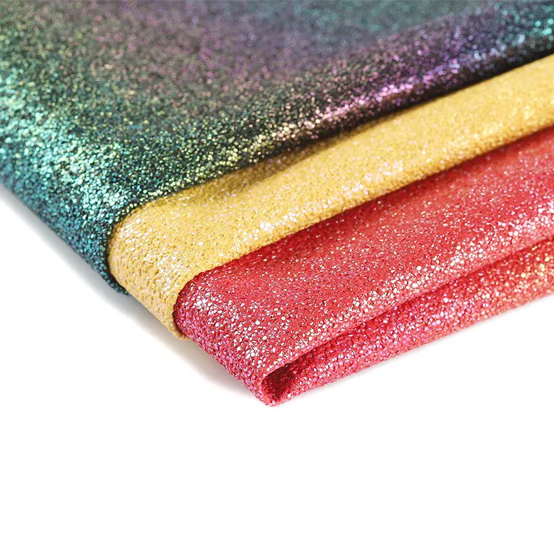 Pelle sintetica del PVC di scintillio di colore graduale di scintillio dell'arcobaleno per il tessuto decorativo del prodotto di cuoio del sofà della borsa del seggiolino auto all'ingrosso
