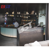 Comptoir de bar rond de luxe en marbre contemporain éclairé par LED pour les centres commerciaux et les salles de sport, mobilier de salon d'hôtel