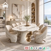 Table à manger moderne en marbre fait main avec 8 chaises rembourrées pour un service d'ameublement sur mesure de villas, hôtels et restaurants