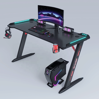 Bureau de jeu d'angle peu encombrant avec étagère de moniteur coudée et crochet pour casque d'écoute intégré pour chambres compactes