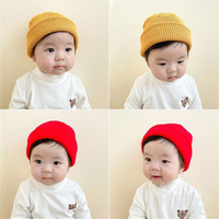 Caramelo Color sólido neón a granel de alta calidad personalizado etiqueta privada Oem bebé invierno niños sombrero niños colorido gorro de punto