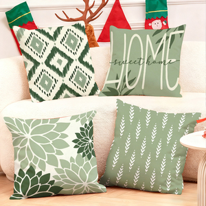Những chiếc gối có họa tiết màu xanh lá cây ấm cúng trang trí phòng khách trong dịp lễ hội, cùng với những chiếc tất Giáng sinh và những chiếc gạc tuần lộc. - Product Image 1