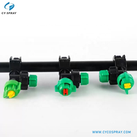 Buse de pulvérisation à clipser en plastique, avec bouchon à vis vert, embout jaune et corps noir, pour lignes de refroidissement et de lavage