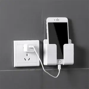 Popular Stock Multifunction New Wall Phone Holder Adhesive Mobile Phone Wall Charger Holder And Remote Control Stand
