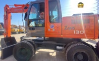 Excavatrice sur pneus Hitachi ZX130W avec peinture d'origine, moteur Isuzu, 13 tonnes, 87,2 kW, haute performance, en stock