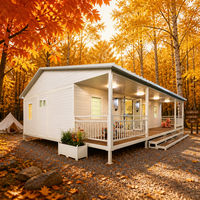 Studio de jardin modulaire préfabriqué avec terrasse surélevée, marches et grande porte vitrée pour espace de bureau à domicile