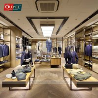 Présentoir à vêtements en acier inoxydable OUYEE pour magasin de détail, support personnalisé pour chemises en tissu