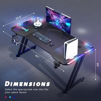 Escritorio Gamer Ergonómico RGB LED al por Mayor con Portavasos, Estructura Robusta en Forma de Z, Mesa de Computadora de Metal, Superficie de Fibra de Carbono, Estilo Moderno para Estudio