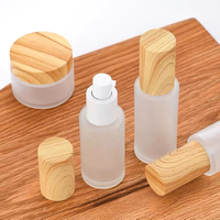 Bentuk datar 30ml 50ml 60ml 100ml topi lukisan kayu kosmetik stoples krim kaca wajah untuk penyemprotan penyimpanan dan tampilan rias