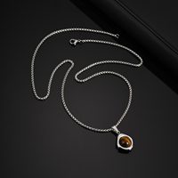 Haute qualité sans ternissement en acier inoxydable pendentif en argent oeil de tigre pierre de Jade noir Onyx collier bijoux pour hommes en gros