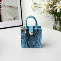 Nouvelle pochette à monnaie en cuir PU, nouveau sac pendentif, étuis à rouge à lèvres, sac pour écouteurs et clés de voiture, mini porte-monnaie, porte-clés en cuir