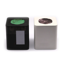 Lata de hierro de hojalata cuadrada negra con ventana circular verde para almacenar café y pequeño, lo que permite una fácil vista del contenido