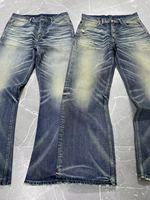 Vêtements de rue pour hommes de haute qualité Pantalons évasés avec broderie croisée de charpentier orange Jeans de détresse pour hommes