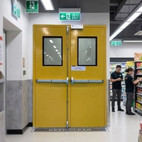 Porte coupe-feu en acier certifiée UL/Intertek pour centres commerciaux et bureaux, avec barres de secours et ferme-portes automatiques