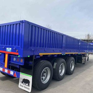 Semi-remorque à ridelles latérales - Semi-remorque fermée à 3 essieux avec ridelles latérales et fond plat, utilisée pour le transport de marchandises en vrac. À vendre. - Product Image 1