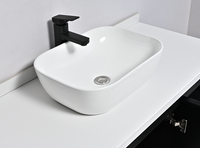 Meuble-lavabo flottant ovale noir mat cannelé de style industriel moderne avec lavabo à poser, capteur tactile intelligent et LED à intensité variable pour hôtels et villas