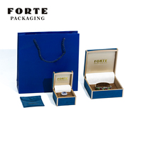 Boîte à bijoux en cuir PU bleu foncé, bord rond, cadre en plastique, logo personnalisé, design moderne pour emballage cadeau, vente en gros