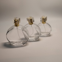 Échantillon gratuit, flacon de parfum en verre vide avec logo personnalisé, nouveau design, 30 ml, 50 ml, 100 ml, flacon de parfum rond plat de luxe