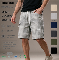 Shorts cargo délavés gris clair pour homme, taille élastique avec cordon de serrage, poches cargo latérales à rabat, poche arrière, coupe ample, longueur mi-cuisse