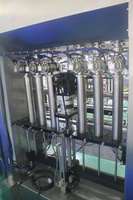 Machine de remplissage automatique de liquides à pistons multi-têtes |   Contrôle servo, haute précision pour les liquides visqueux et non visqueux