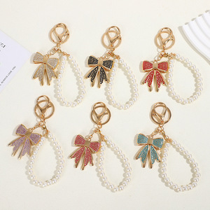 Porte-clés en forme de nœud coloré avec strass, pendentif créatif en métal pour sac de femme, porte-clés, anneau porte-clés - Product Image 1
