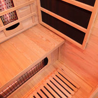 Salle de sauna infrarouge à spectre complet moderne avec construction en bois massif de pruche, capacité de 4 personnes et matériaux écologiques